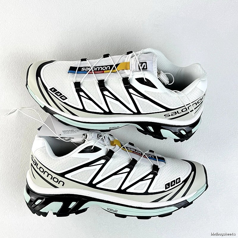 Salomon White and Black Trail Sneakers Highlighting Treaded Trail Sole