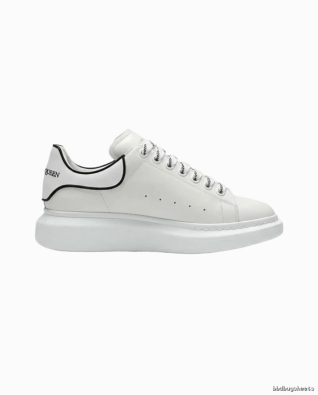 The minimalist style of McQueen white sneakers.